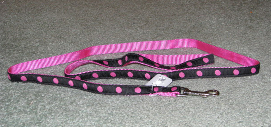 Pink and black nylon dog leash.